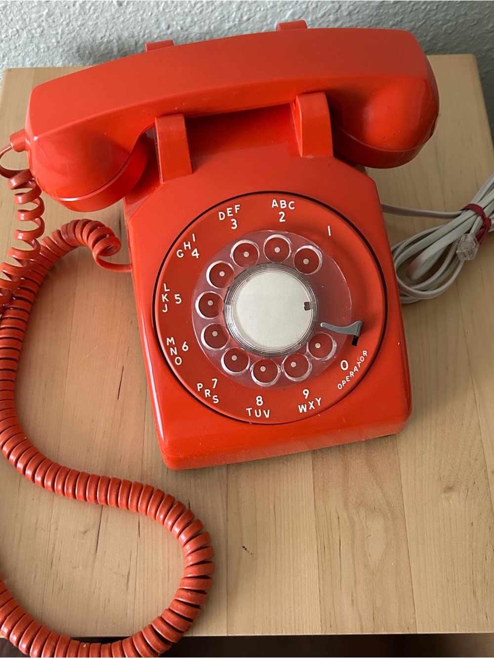 Vintage orange Rotary dial Telephone.